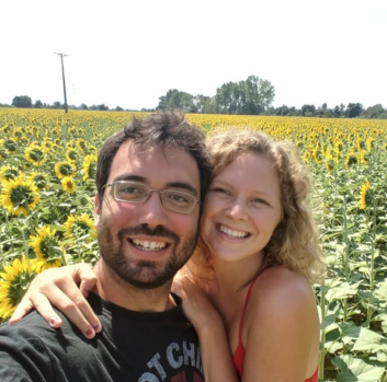 A selfie of Izan and Audrey in a sunflower field 