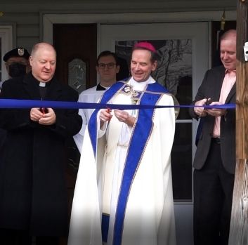 The Rev. James S. Barkett, Bishop Michael F. Burbidge and President of Marian Homes Jim McHugh hosted the ribbon-cutting and blessing ceremony at the new Blue Topaz Group Home in Fairfax