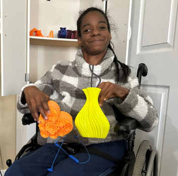 Marquitta smiles with her 3-D creations