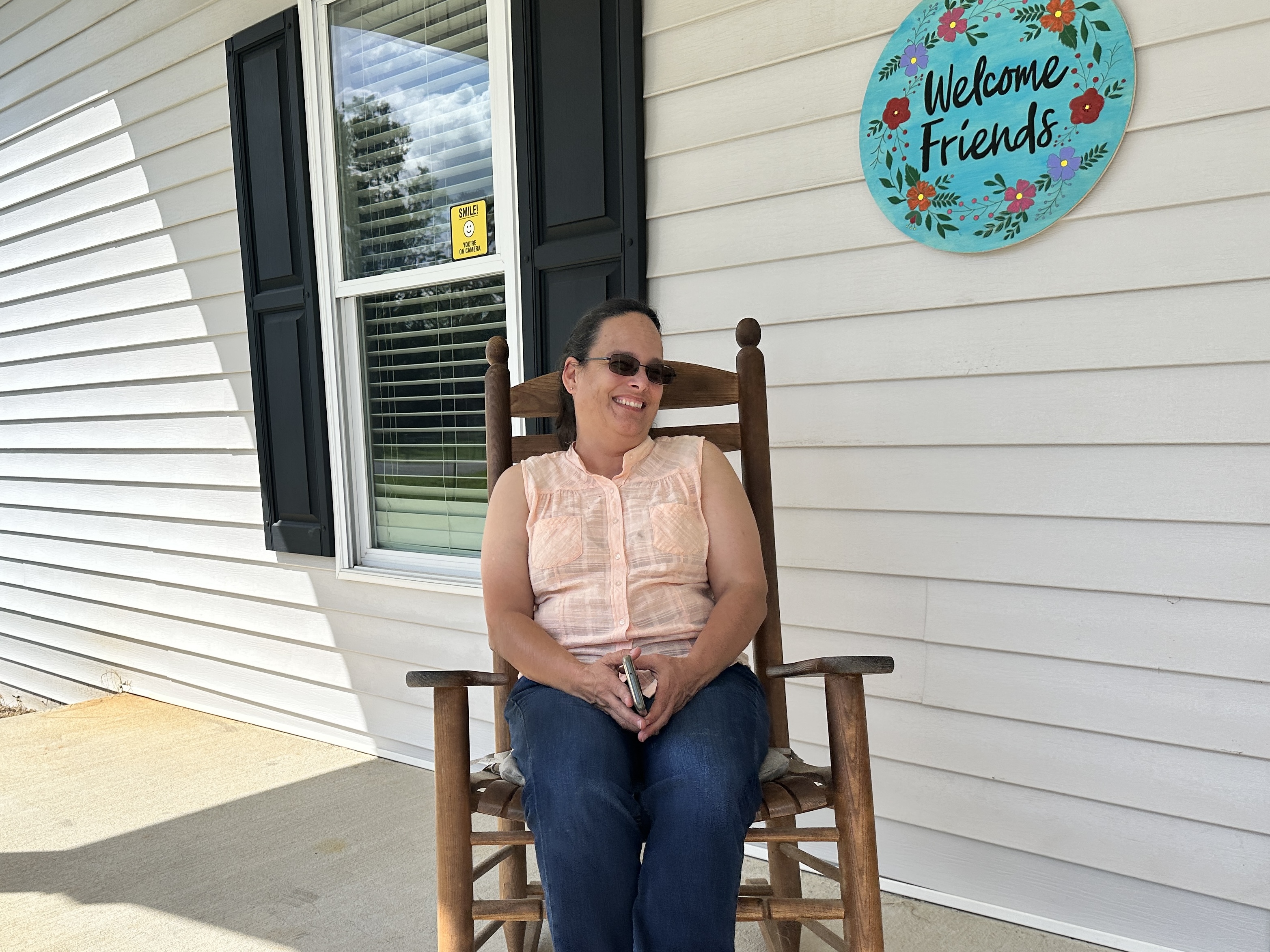 DSP Stormie Shelton smiles from the front porch