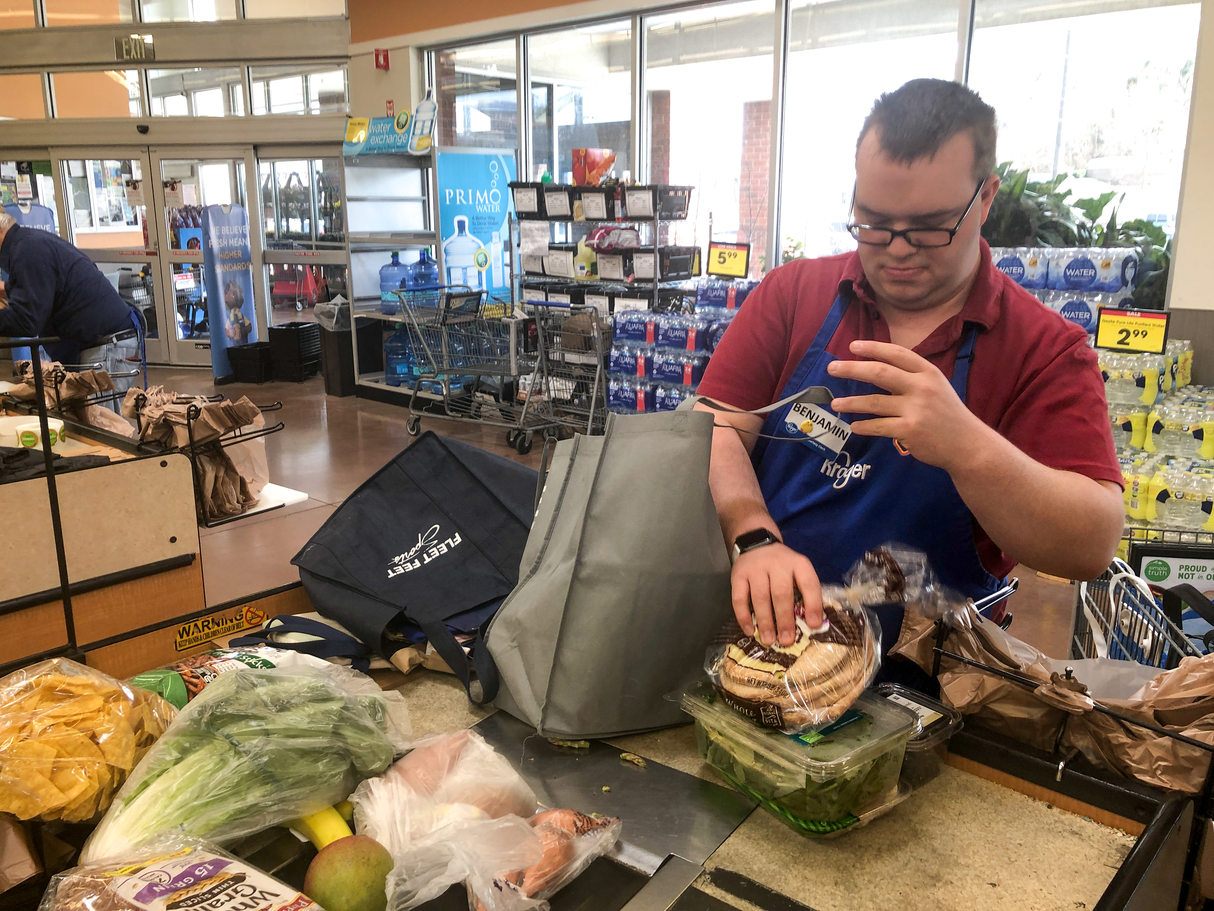 Ben bagging groceries