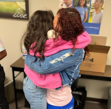 Ana embraces with family