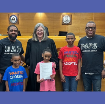 Wil and Justin stand with their children and judge