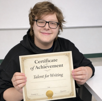 Will shows off his certificate