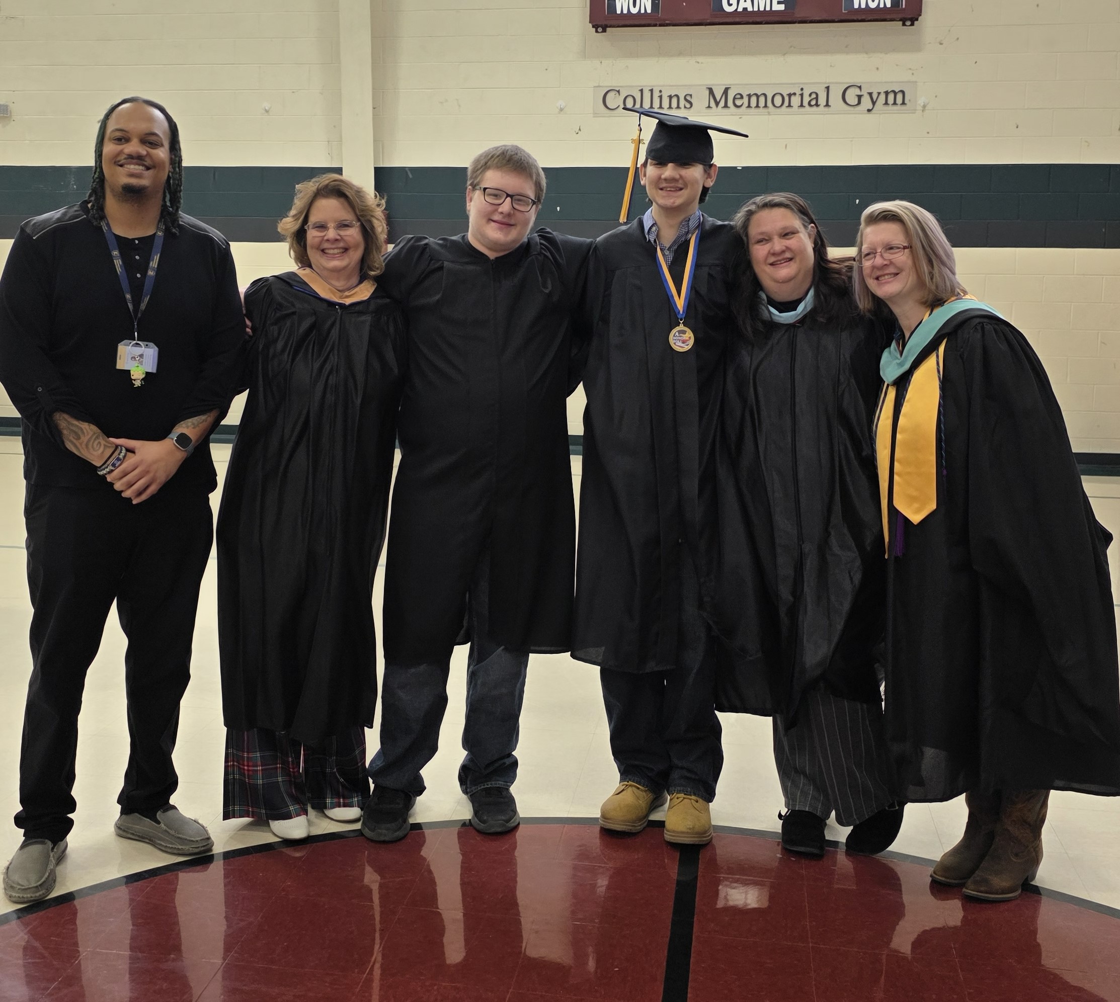 Roger poses with enCircle staff and fellow classmates