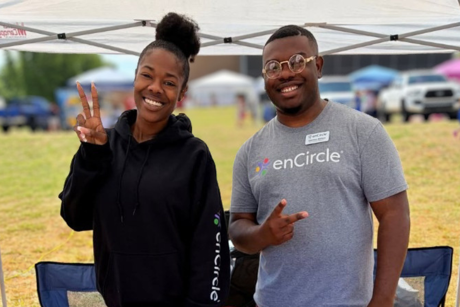 Foster care staff smile for the camera